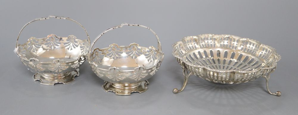 A pair of George V pierced silver bonbon baskets, Birmingham, 1913 and an Edwardian pierced silver dish, London, 1908,
